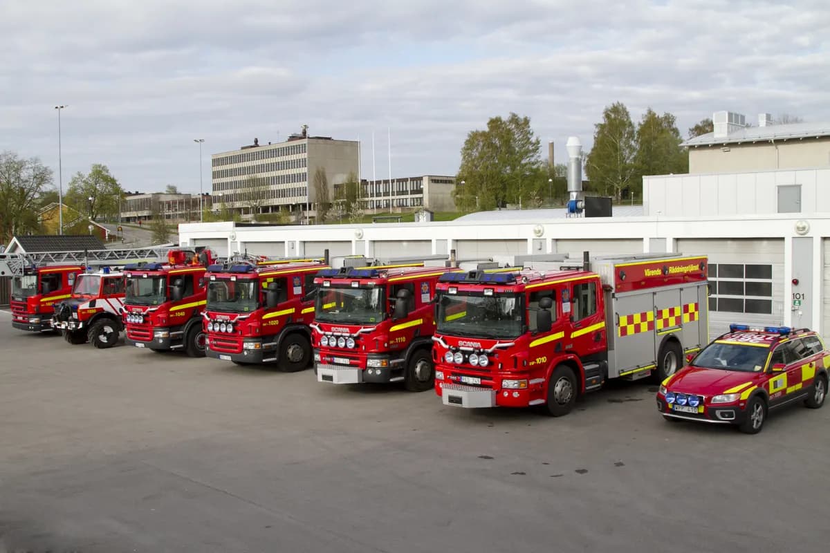 Row of fire trucks and emergency vehicles outside Växjö fire station